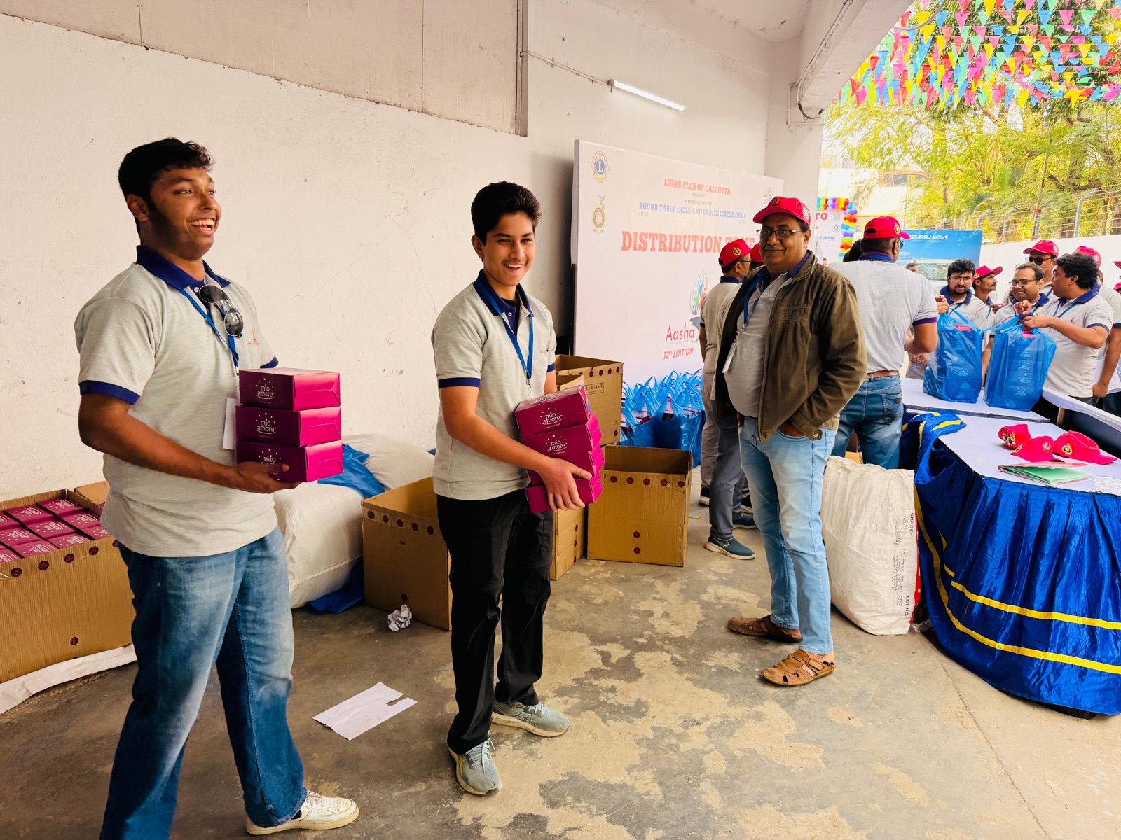 Carrying gift boxes for the children at Aashayein