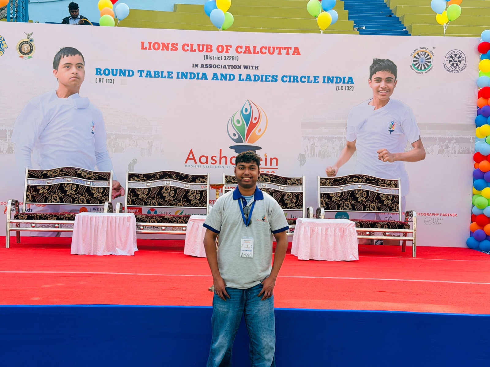 In front of the event posters