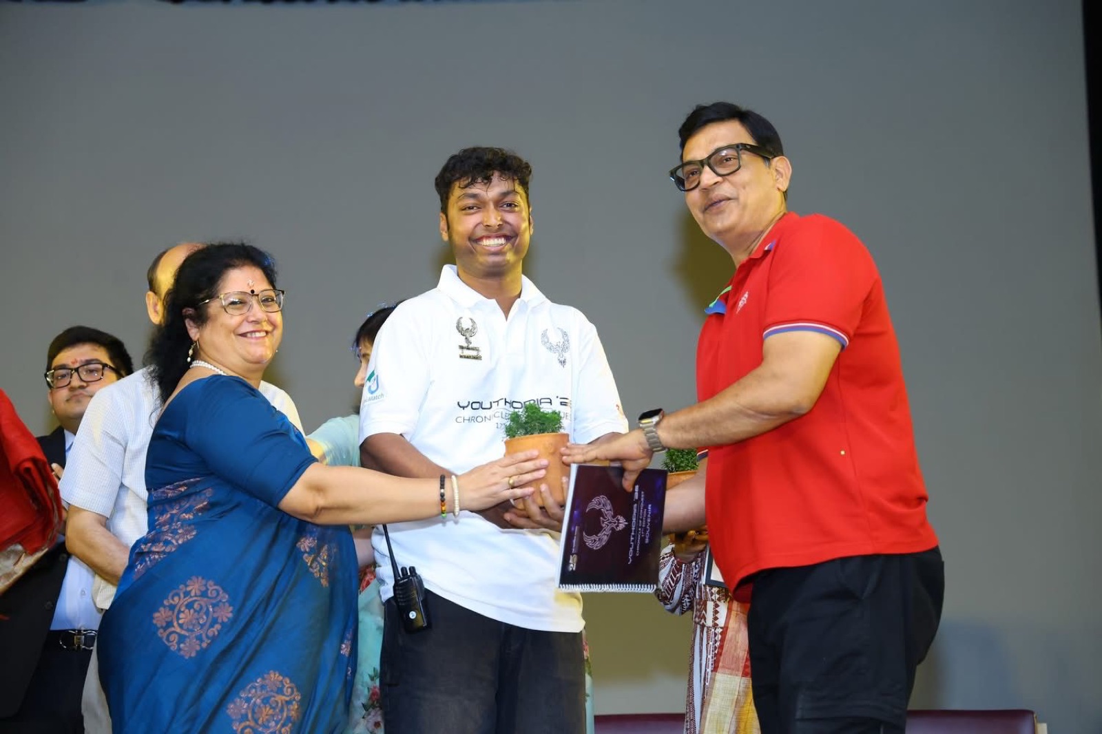 Receiving an award on stage at school